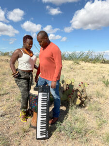 Kevin and Tanishia Hamilton outdoors with a keyboard