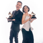 Andres and Christina, from 123 Andres, holding Grammy awards