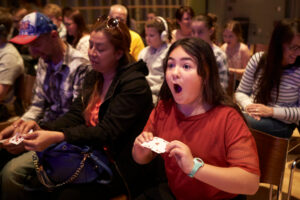 girl amazed by a magic trick